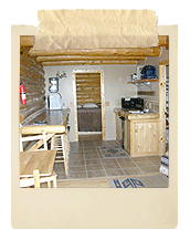 Kitchenette with doorways to bathroom and bedroom